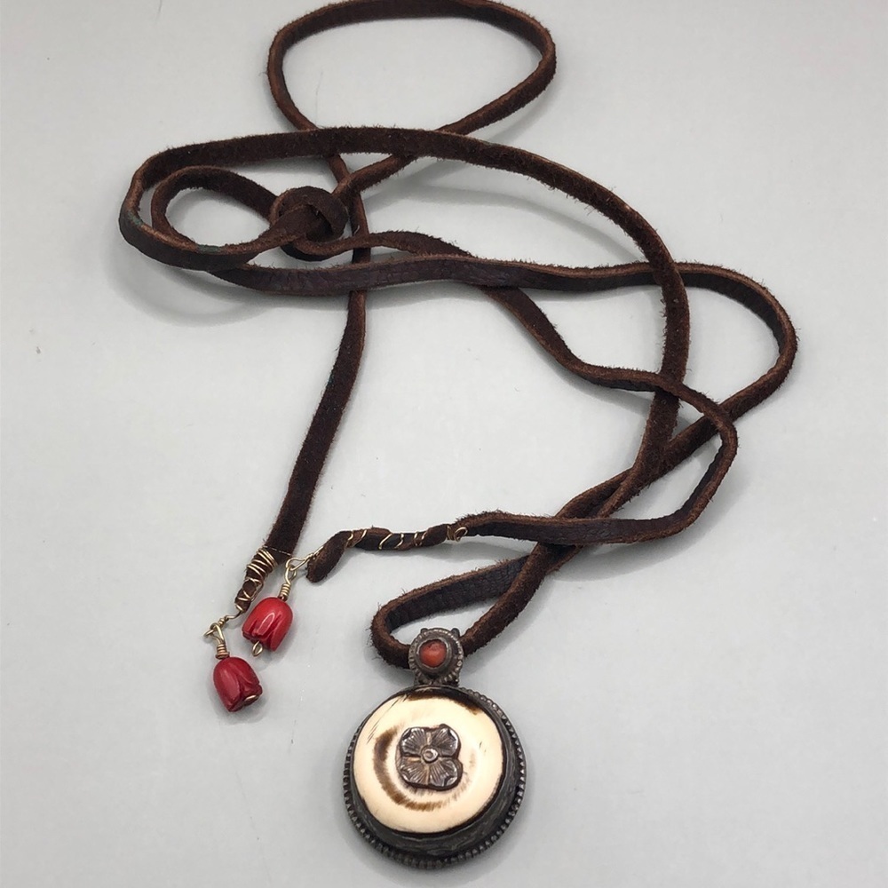 Artisan 2 sided sterling and bone leather cord and coral tie necklace.